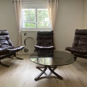 Armchairs by the Norwegian designer Ingmar Relling. Matching coffee table.