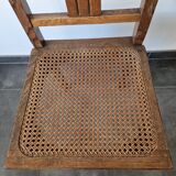 Wooden and cane chair. Carved wooden chair with cane seat.