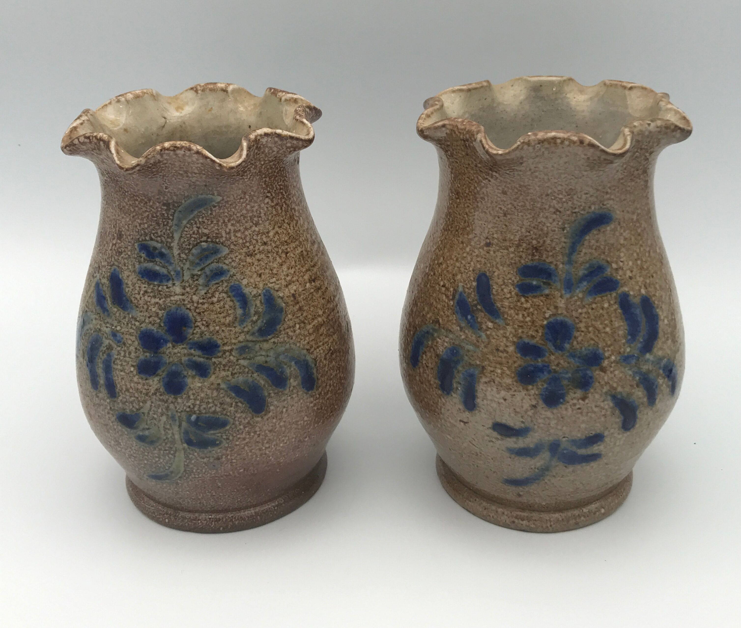 Pair of vintage pottery vases with floral decoration and glaçureau sel