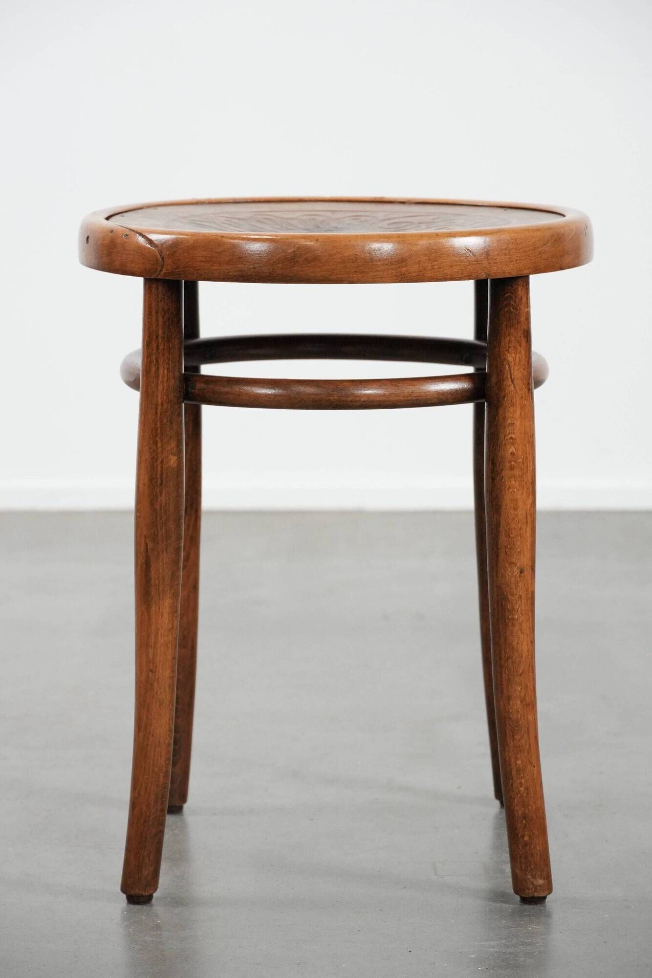 Antique bentwood stool from early 1900s with a seat with beautiful details