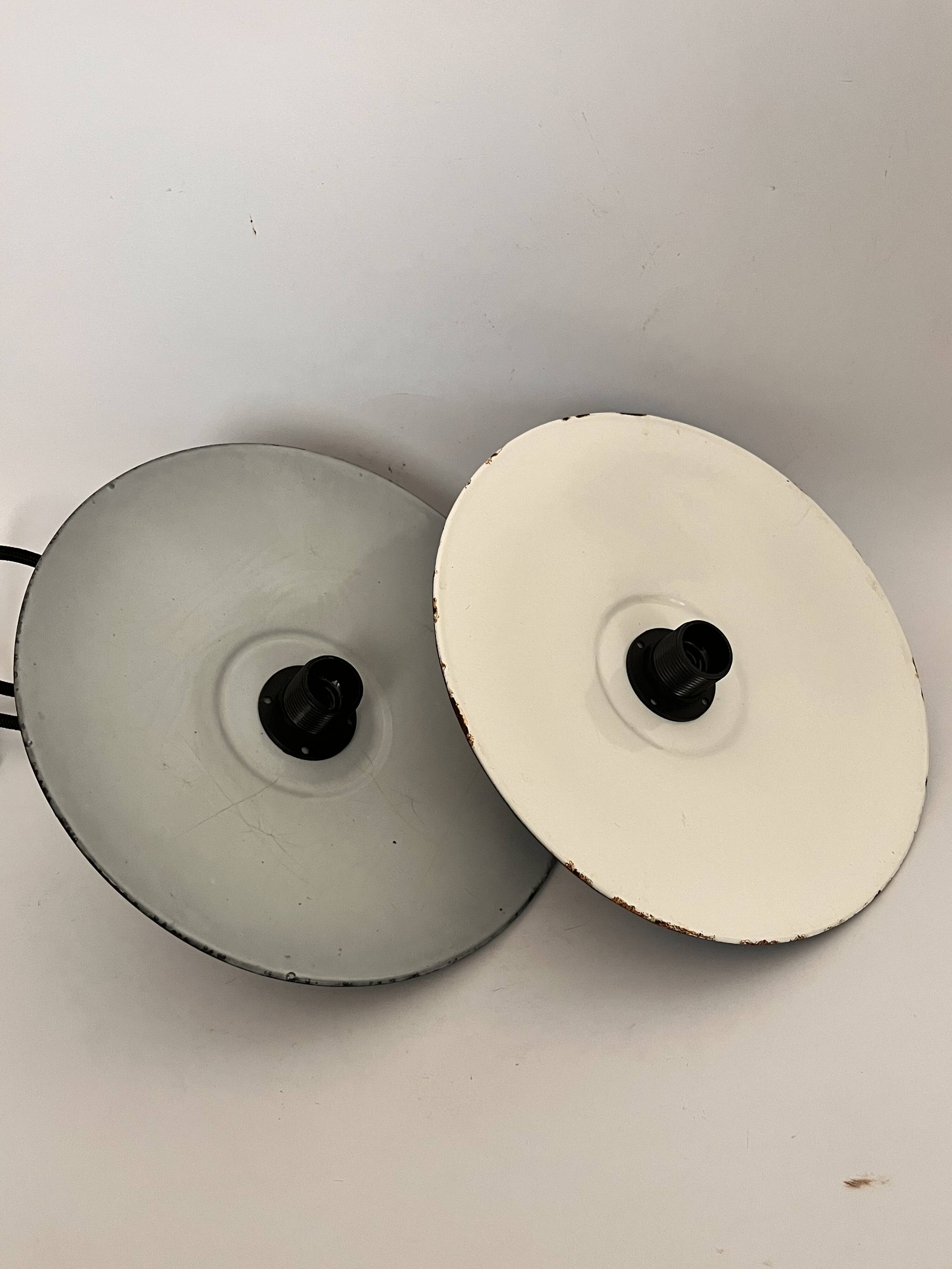 Pair of black enamelled metal bowls