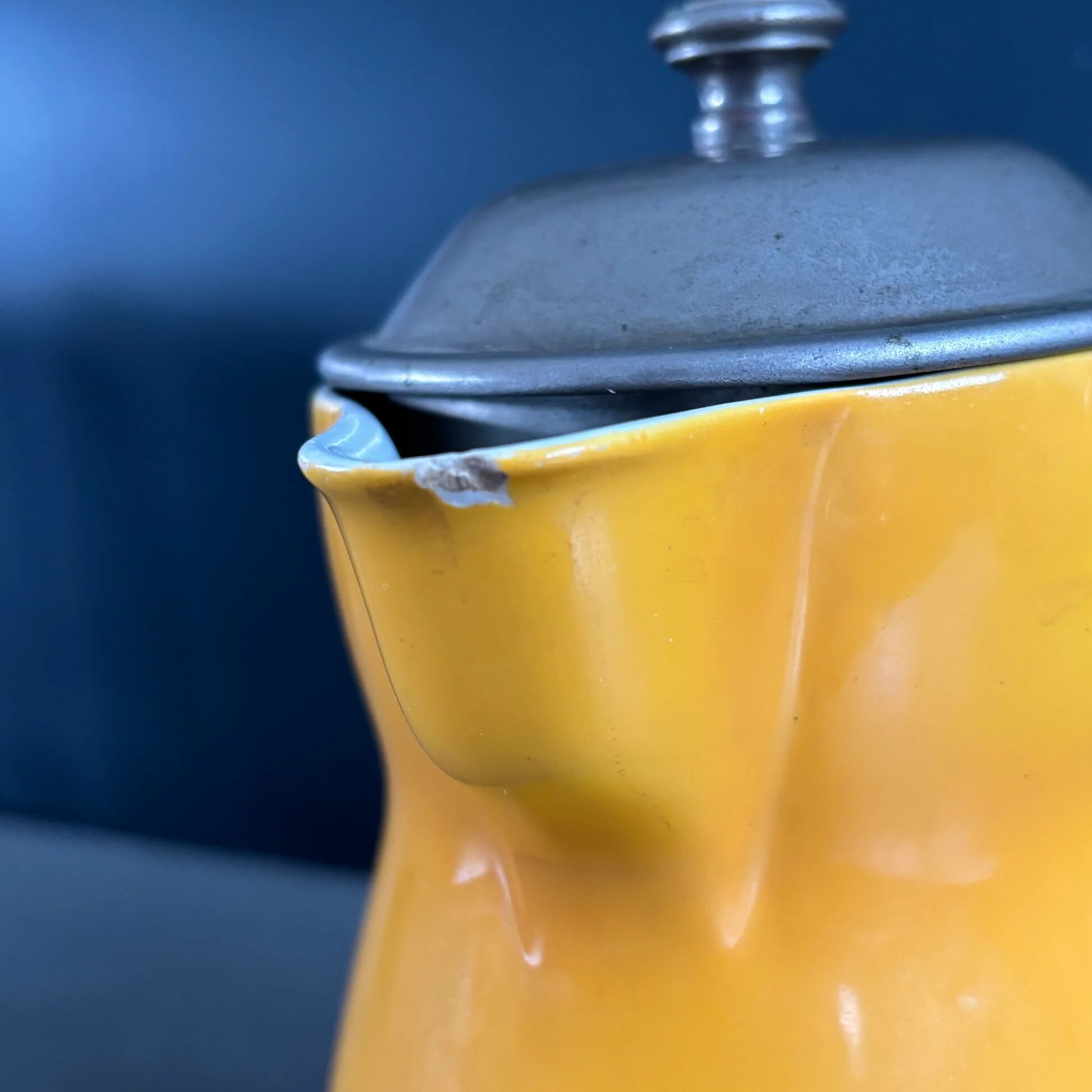 Antique teapot in earthenware with a tin filter lid.