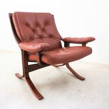 Scandinavian armchair made of wood and cognac leather