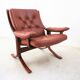 Fauteuil scandinave en bois et cuir cognac