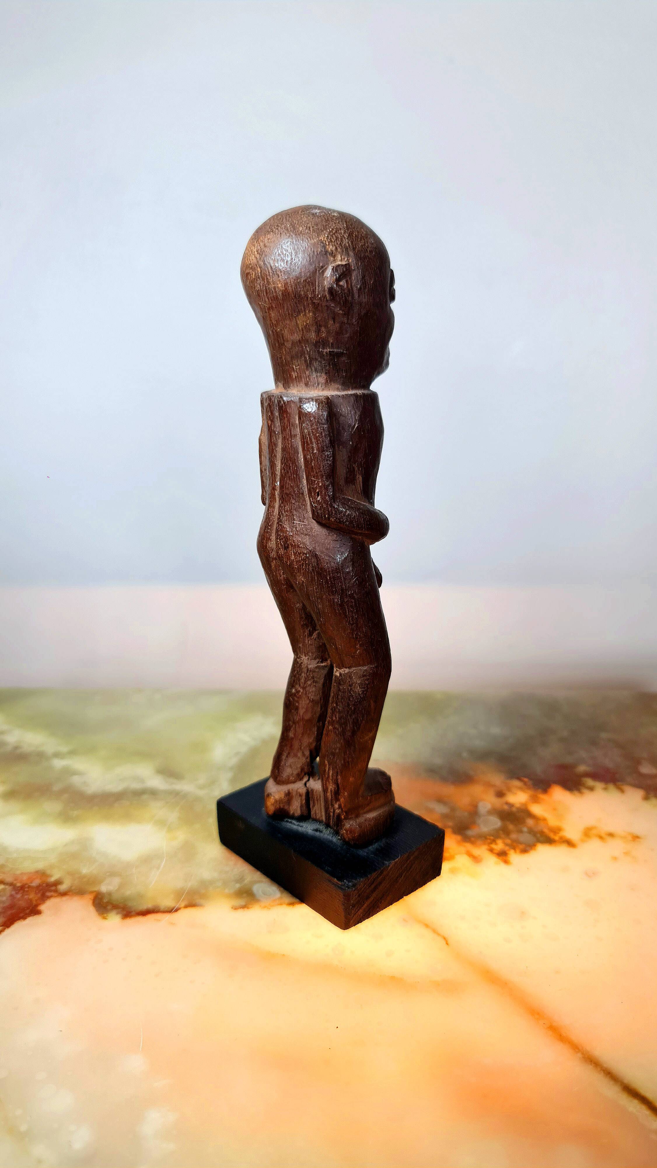 Old Fon statuette on a base, Benin