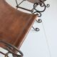 Paire de fauteuils en fer forgé et cuir vintage