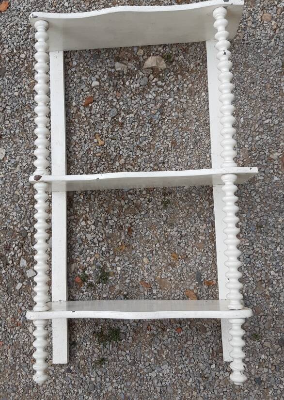 charming curved shelf with 2 turned wooden supports