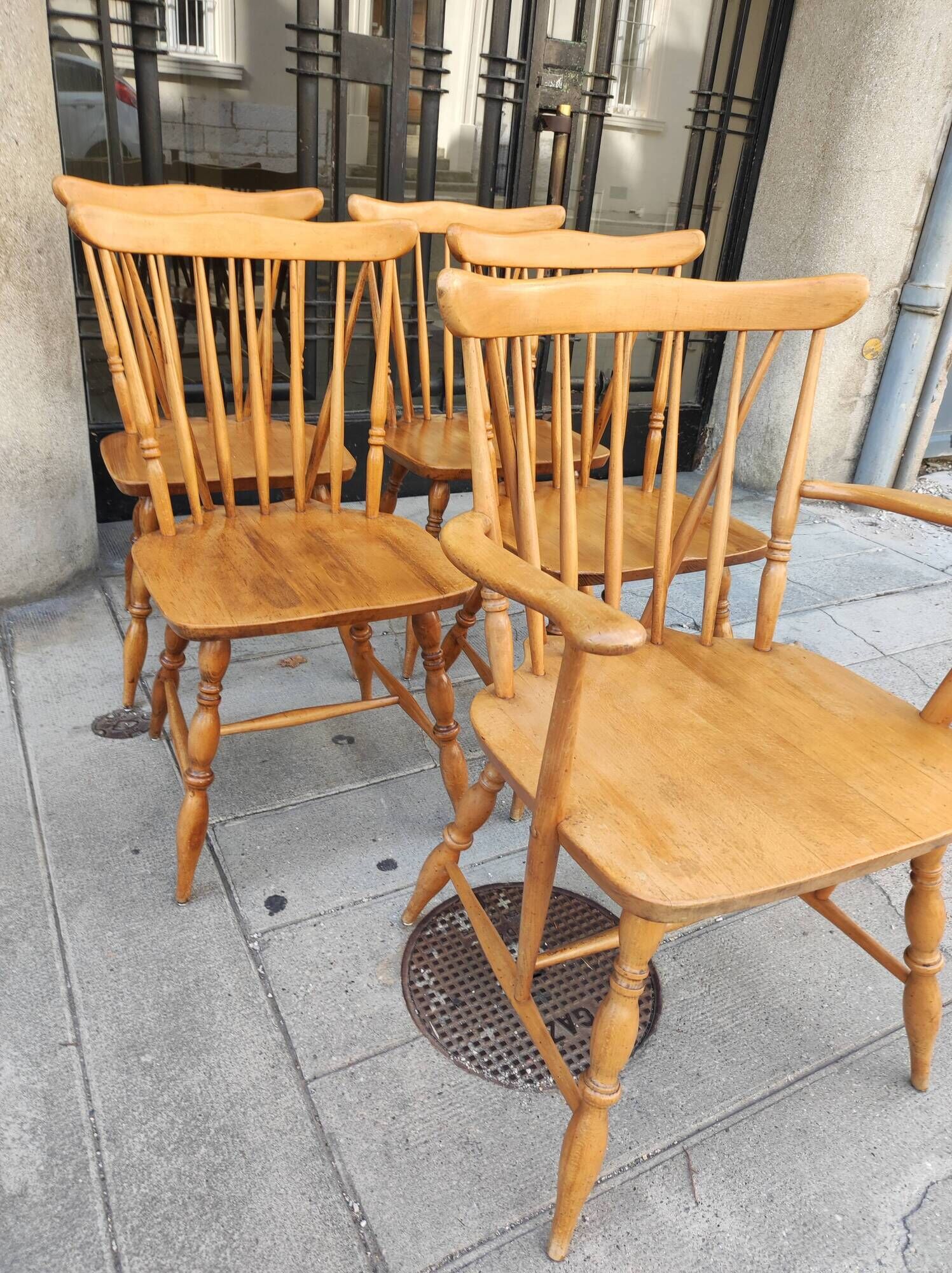 Four chairs and a Heywood Wakefield Windsor armchair. Vintage