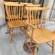 Four chairs and a Heywood Wakefield Windsor armchair. Vintage