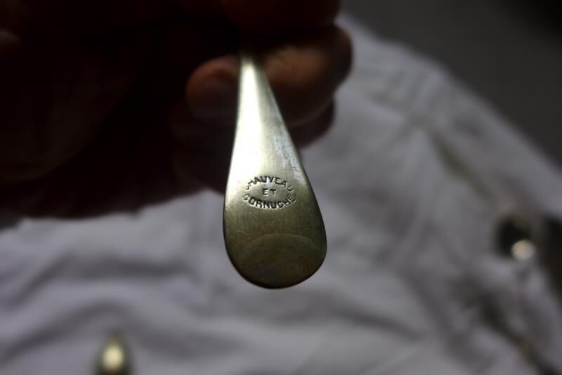 10 small silver spoons