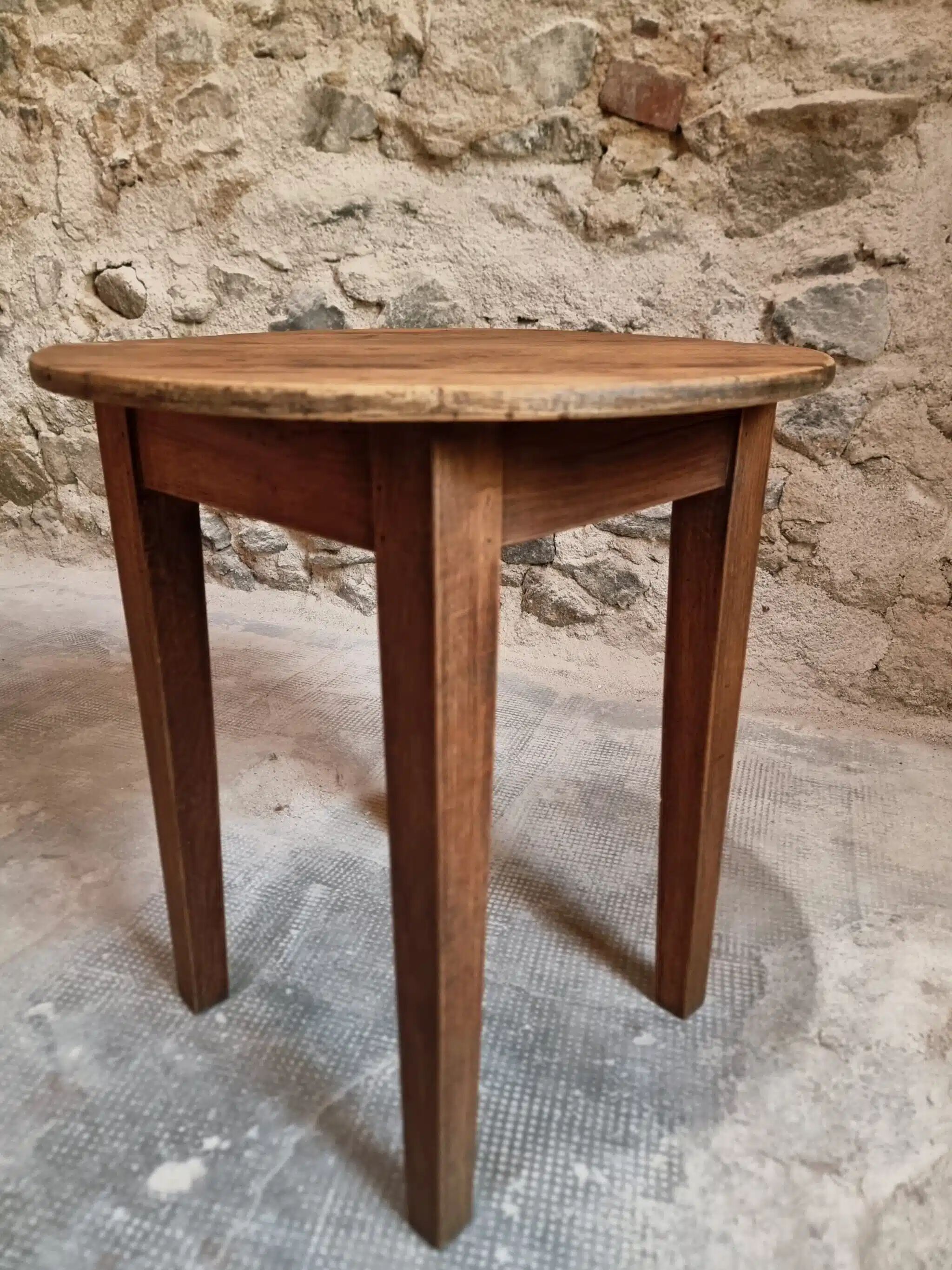 Antique round side table with oak legs and a pine top, circa 1900.
