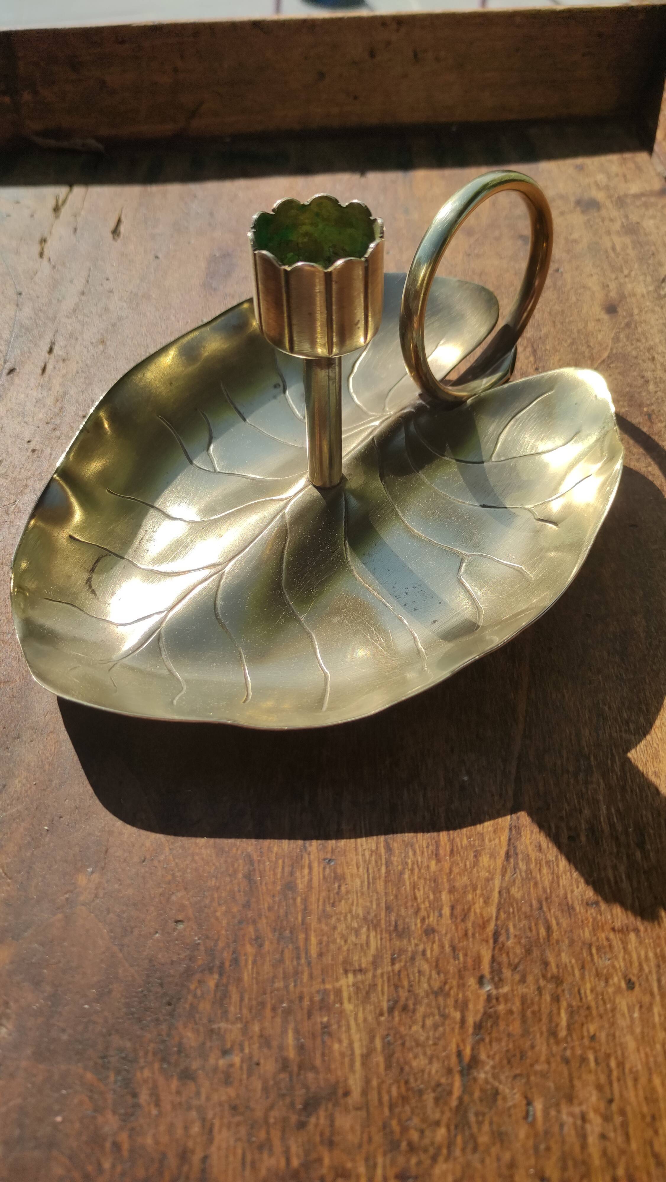 Vintage candle holder in golden brass