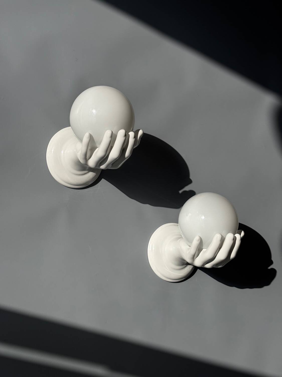 Pair of opaline and ceramic hand sconces