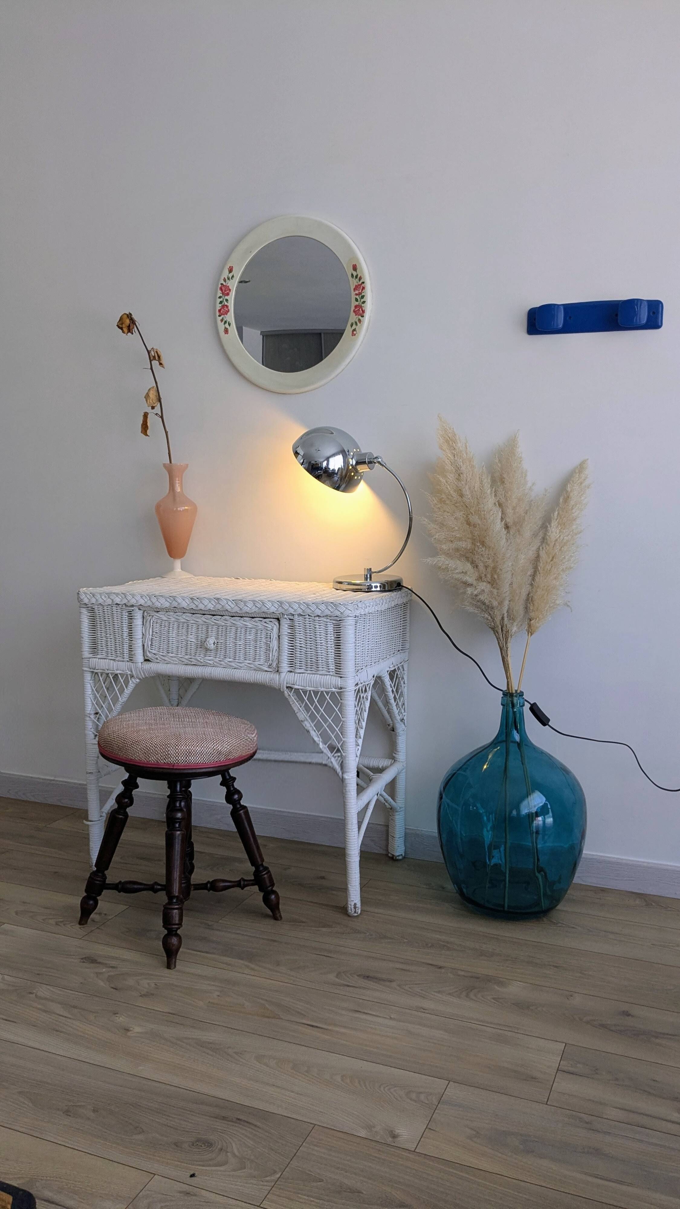 Vintage round mirror Syla model 6131 with rose decoration.