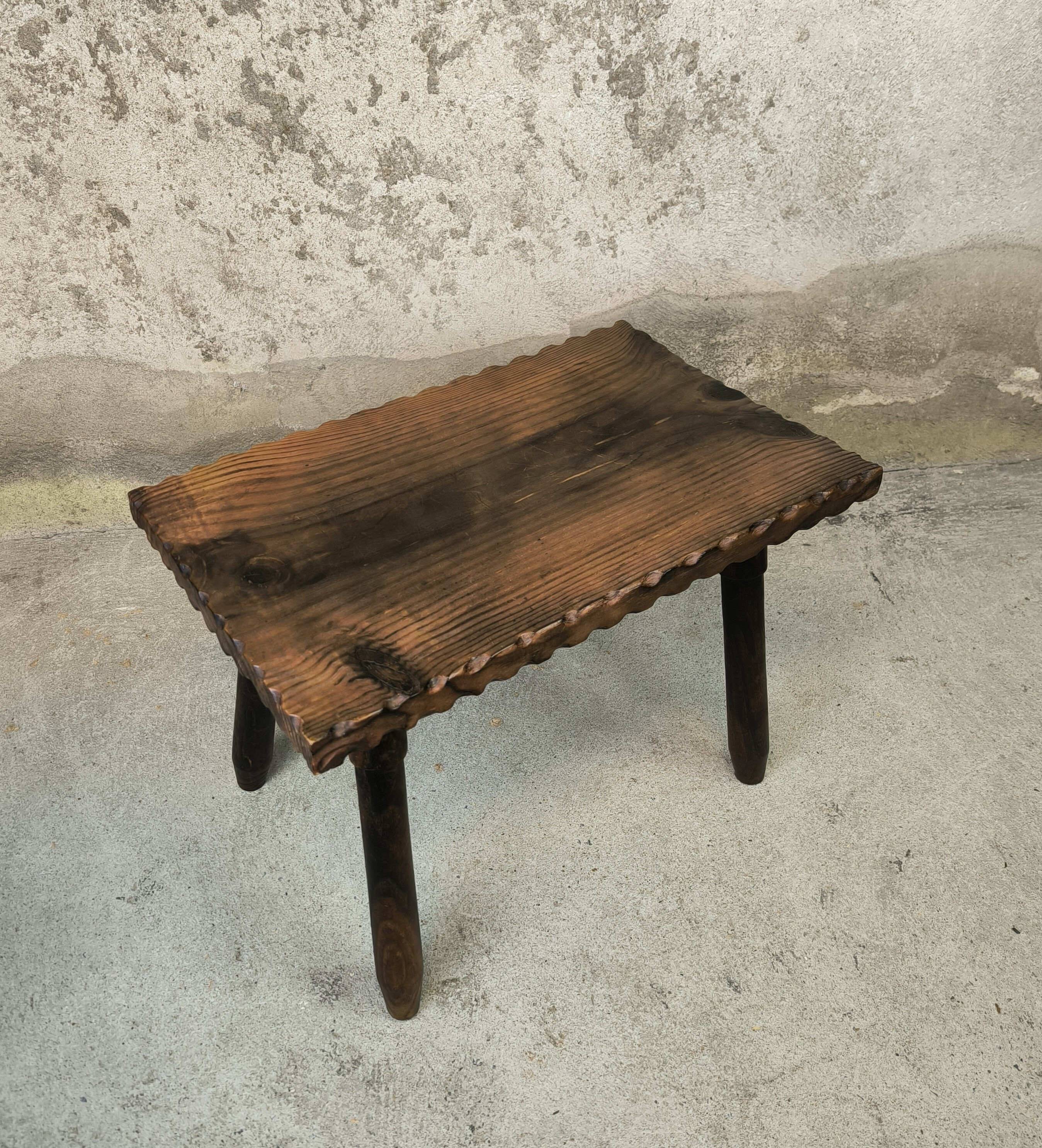Small vintage coffee table made of solid wood.