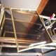 Brass and smoked glass bar trolley with casters