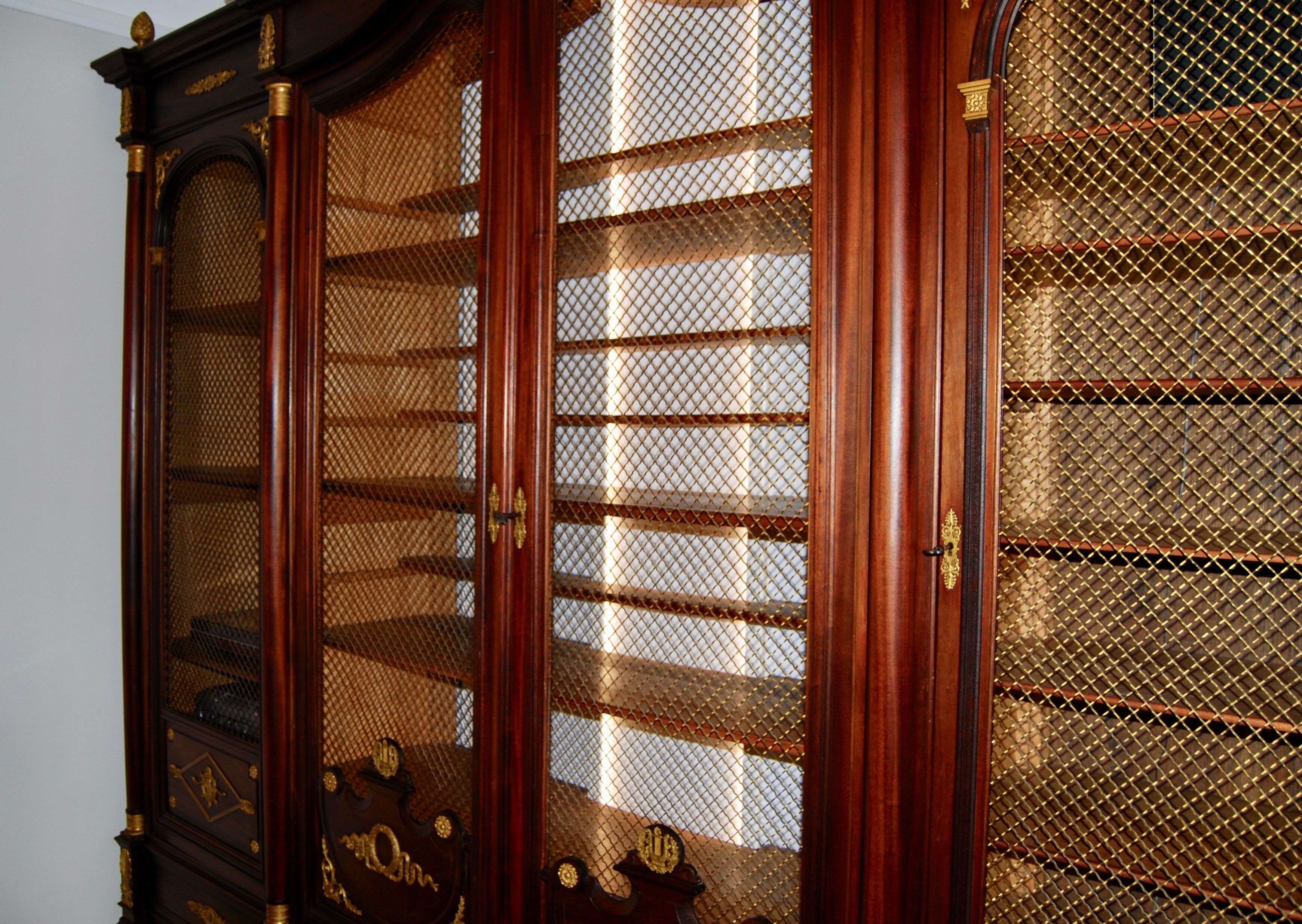 Large Empire library in solid mahogany, late nineteenth century