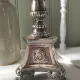 Old church candlestick in silver-plated metal