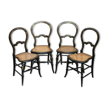 Four antique Regency bergère chairs with mother-of-pearl inlay.