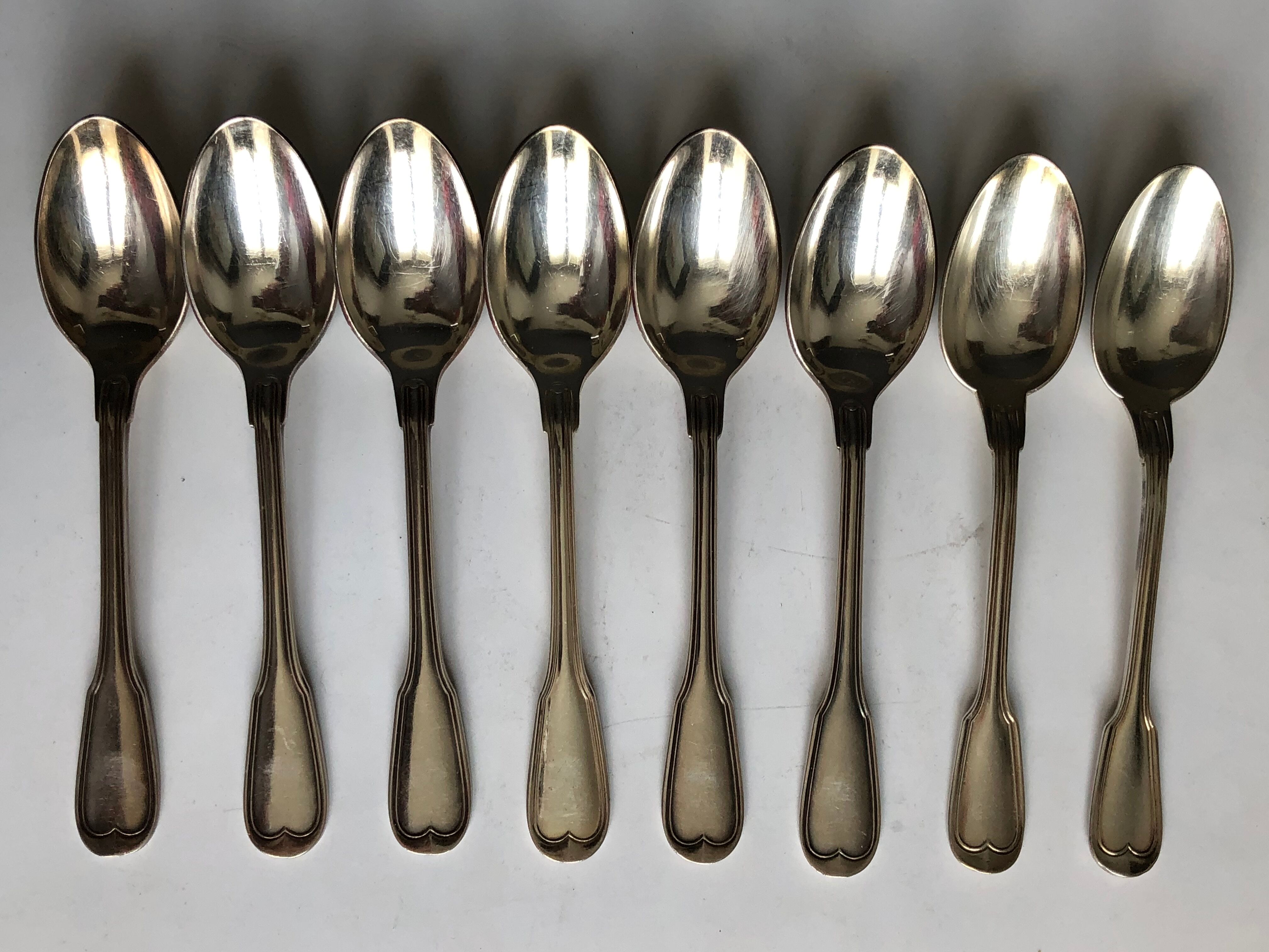 Set of 8 small silver metal spoons
