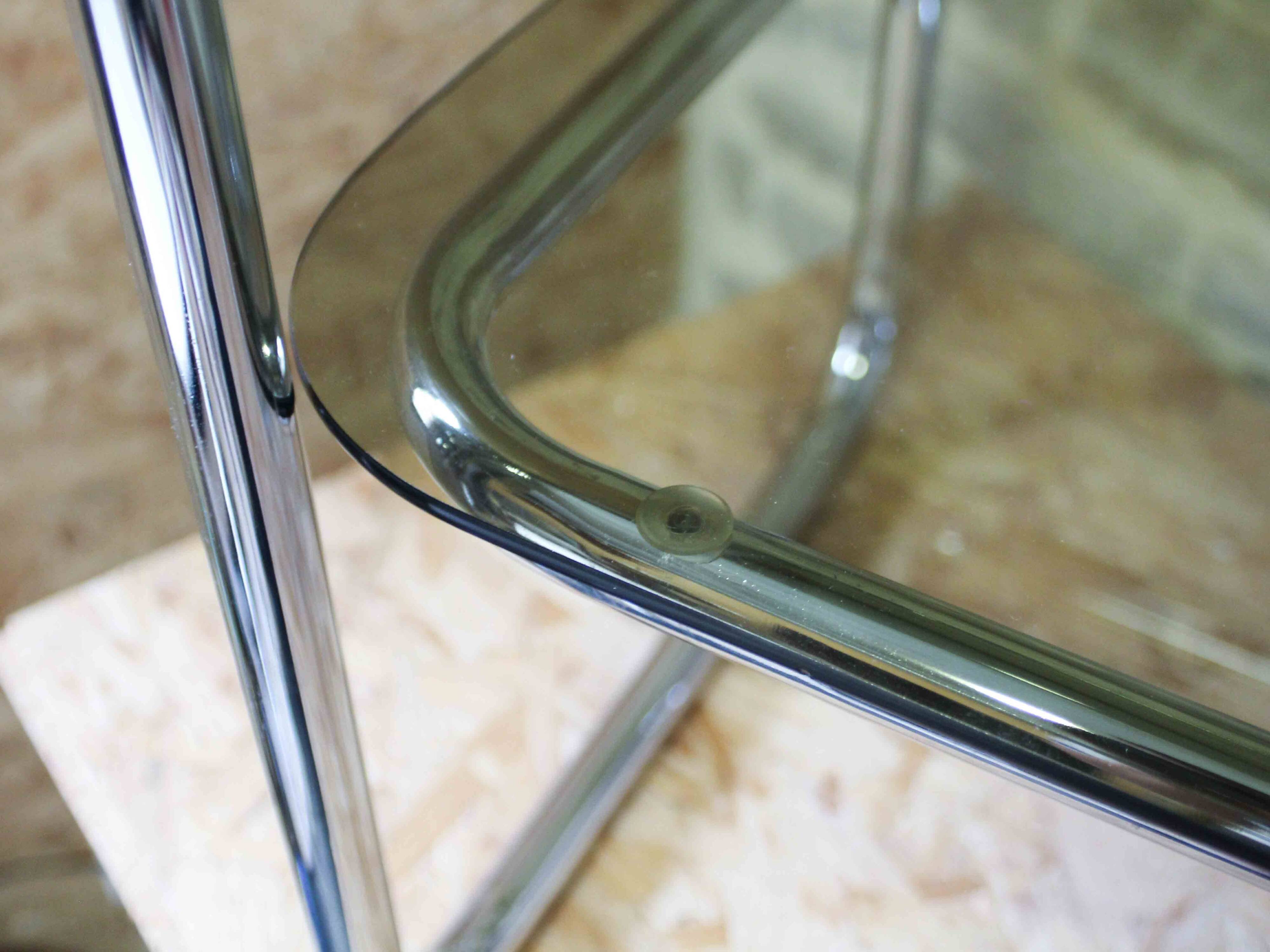 Chrome metal and smoked glass side table.