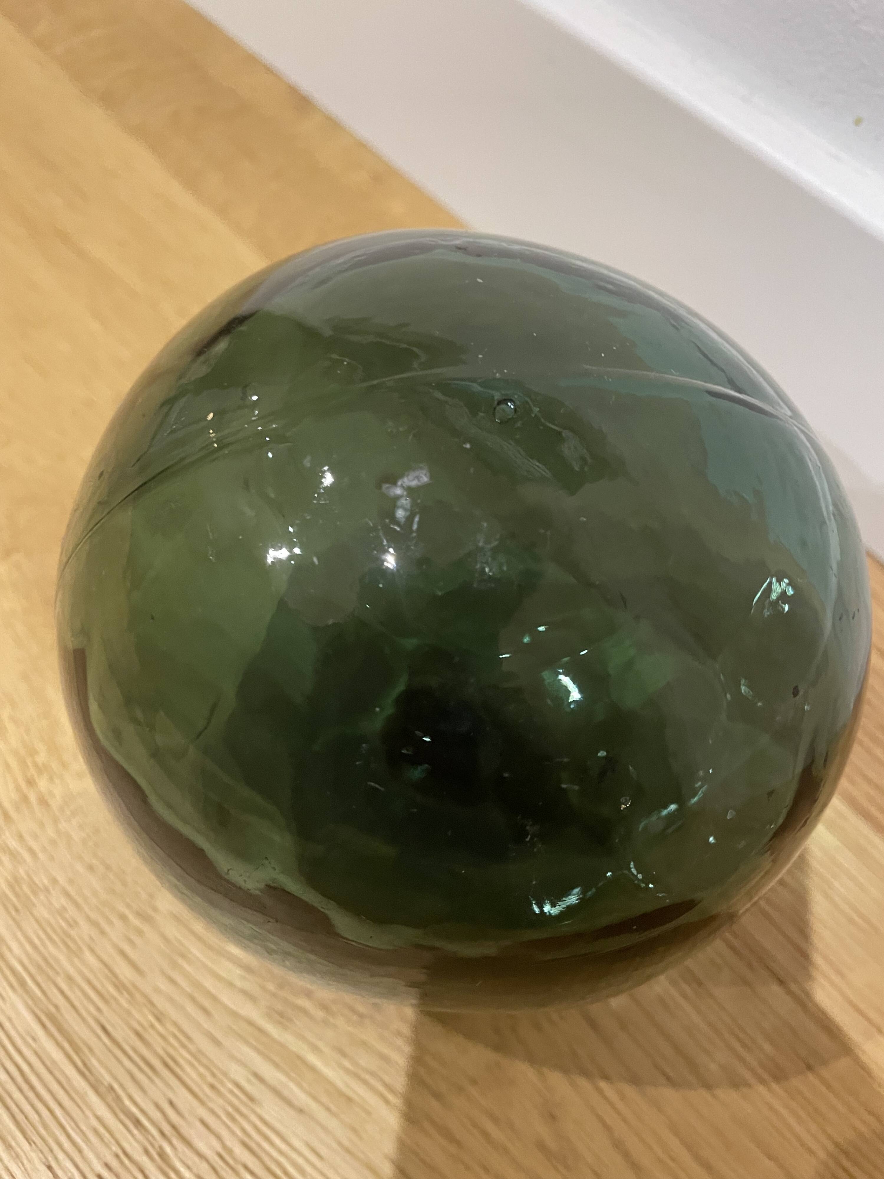 Floating fishing ball in glass