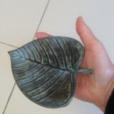 Greenish metal leaf pocket emptier