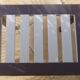 Coffee table or side table in style with its brass strips totalem.