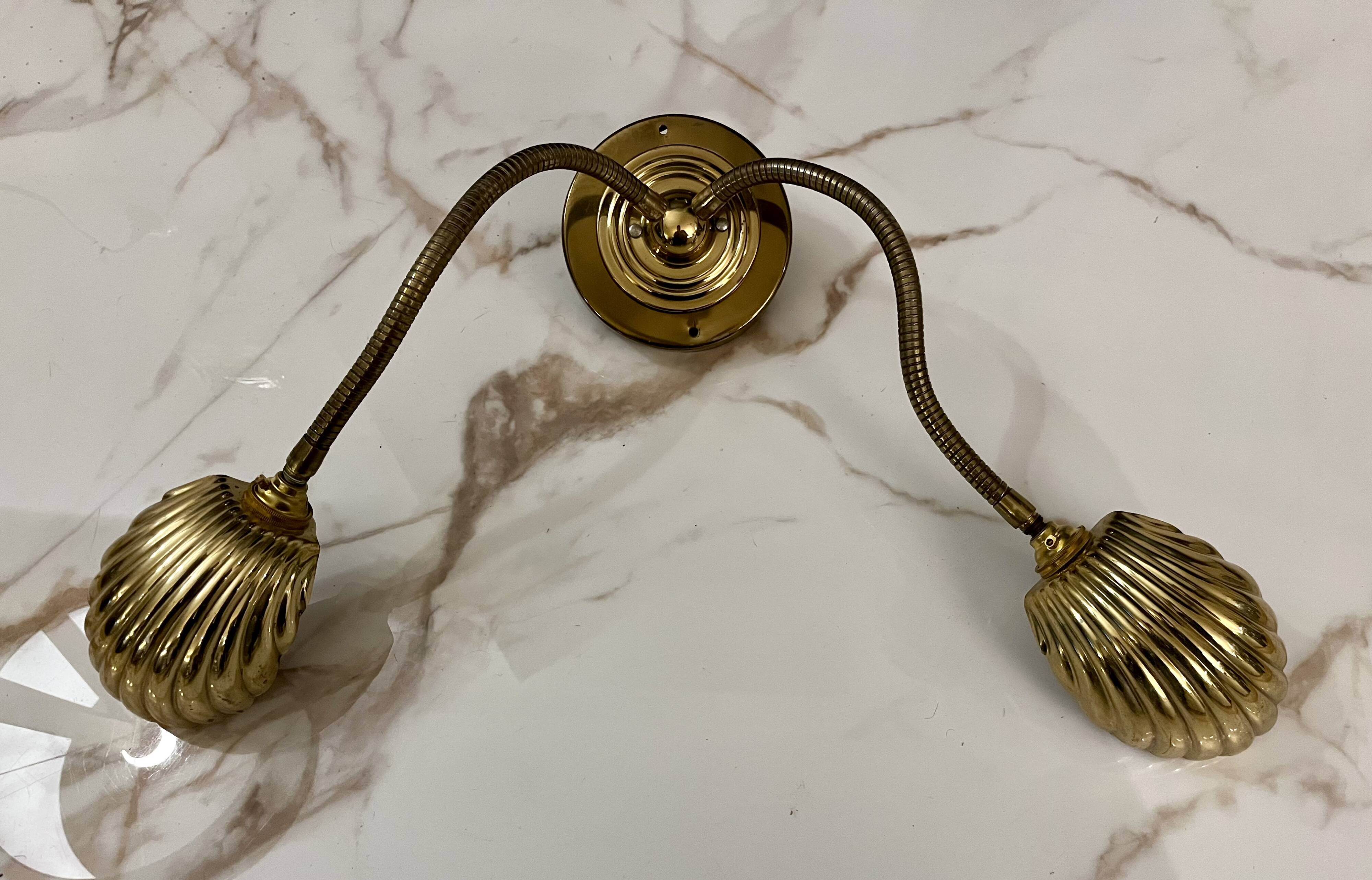 Articulated shell wall light