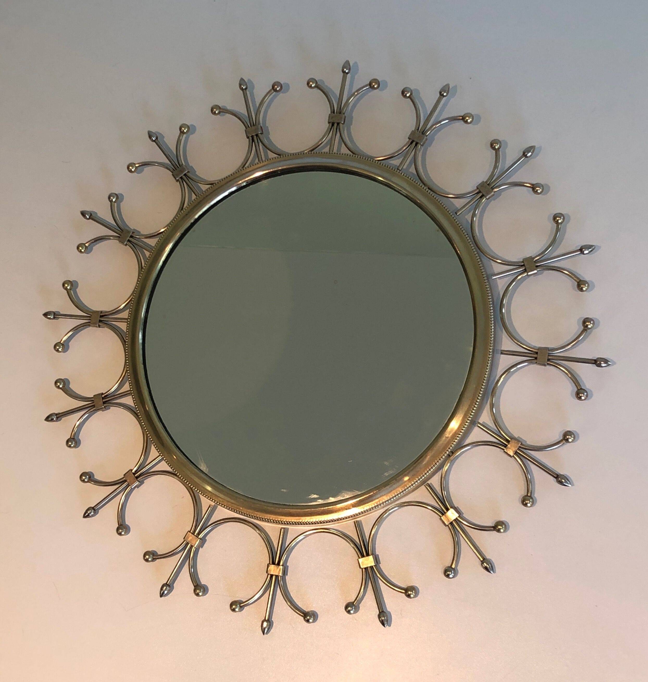 Sun mirror in brass and brushed steel