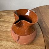 Glazed earthenware jug