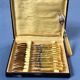 Brass and yellow galathite cake forks
