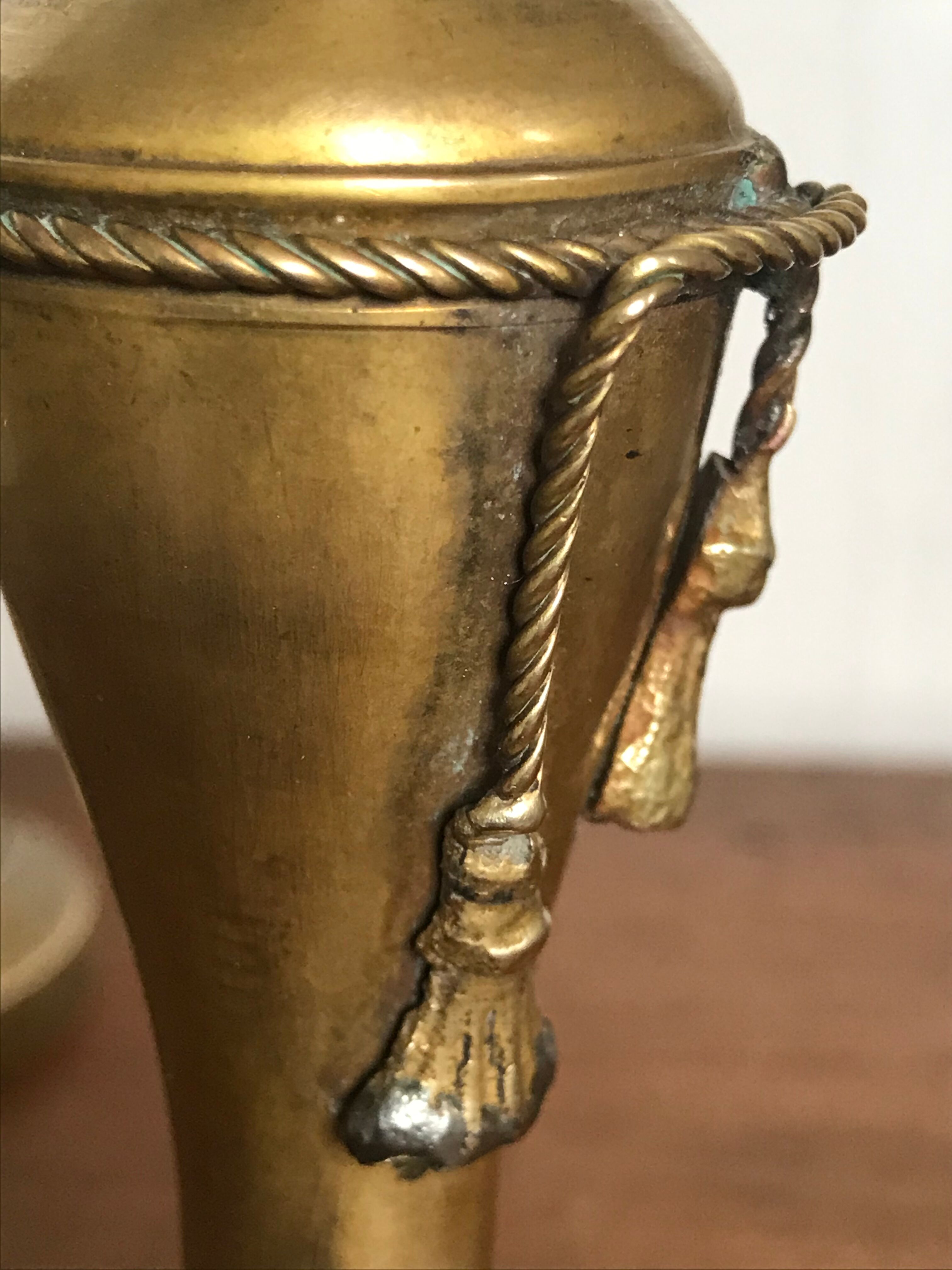 Pair of brass candlesticks with tassels