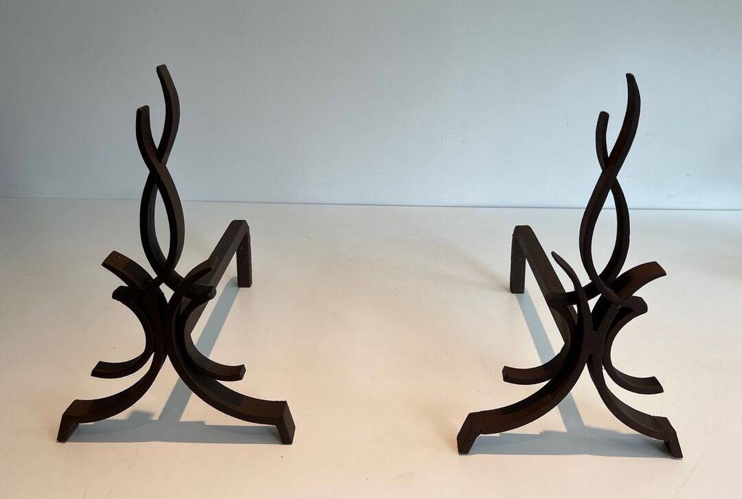 Pair of Wrought Iron Andirons with Stylised Flamboyant Uprights and Enrobed Feet