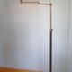 Articulated brass floor lamp