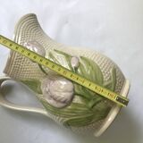 Barbotine pitcher with embossed tulip decoration and spike