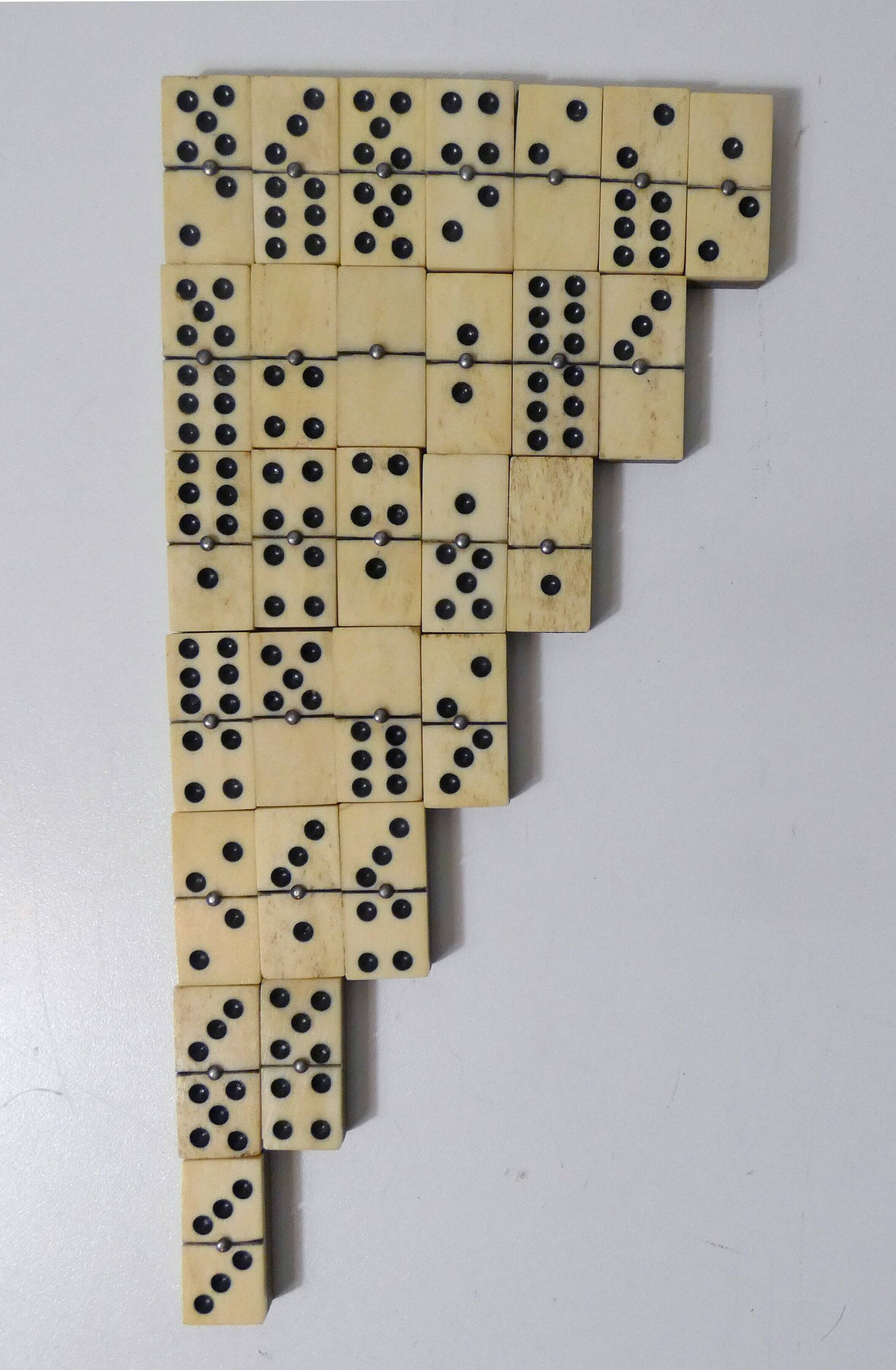 Antique set of dominoes made of bone and wood