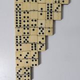 Antique set of dominoes made of bone and wood