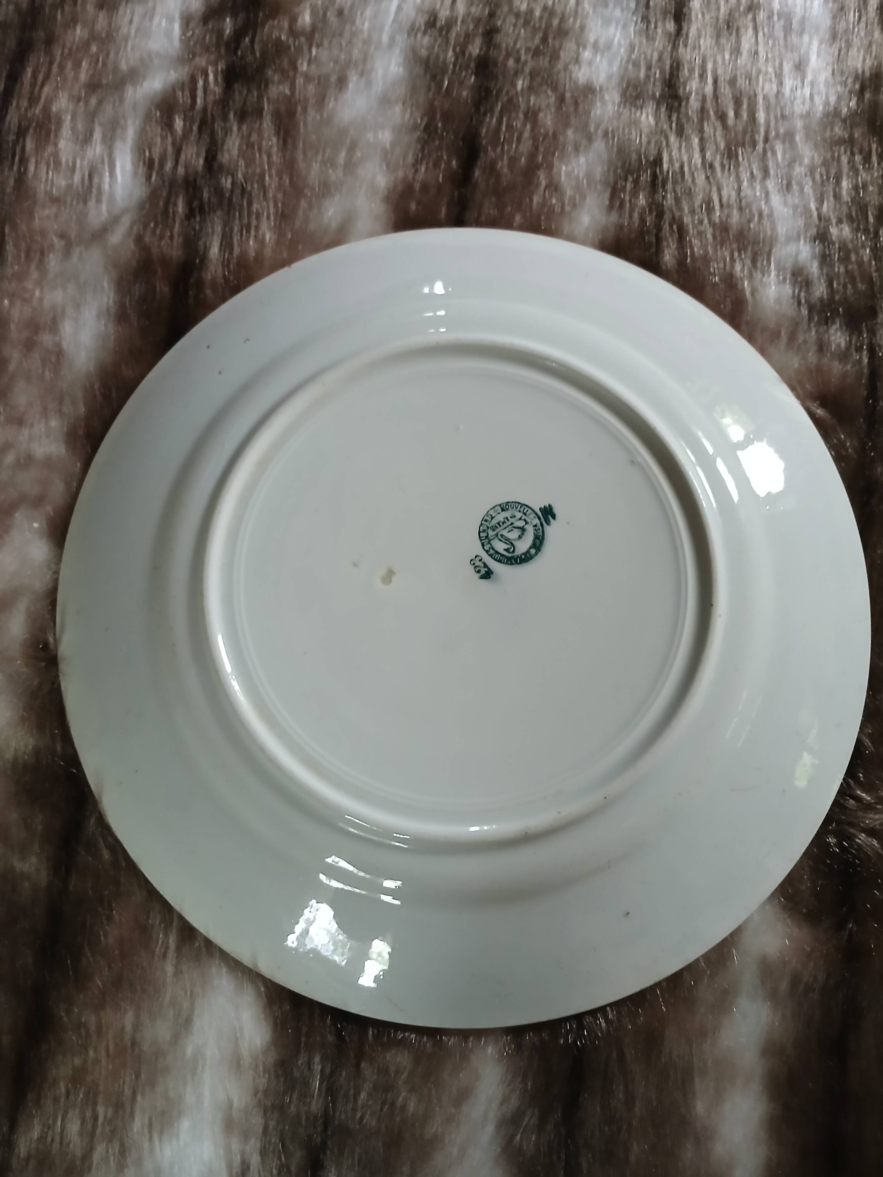 Old round plate made of ironstone
