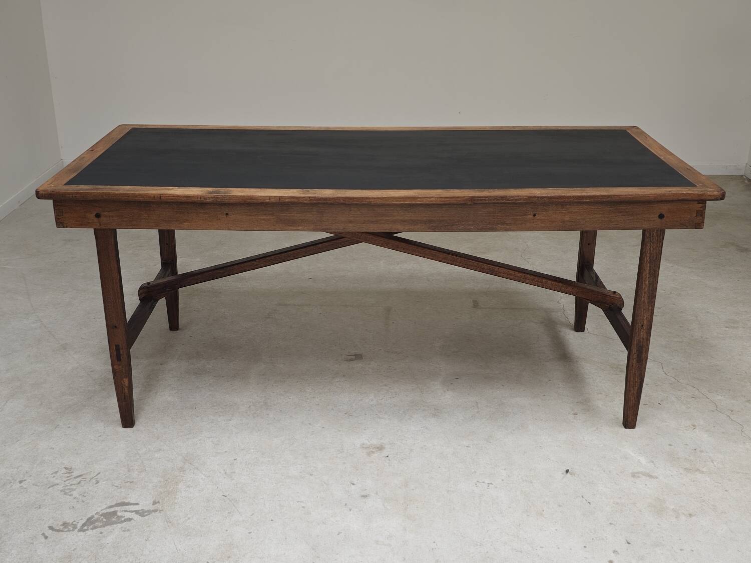 Vintage workshop folding table in oak with a hand-patinated black top.