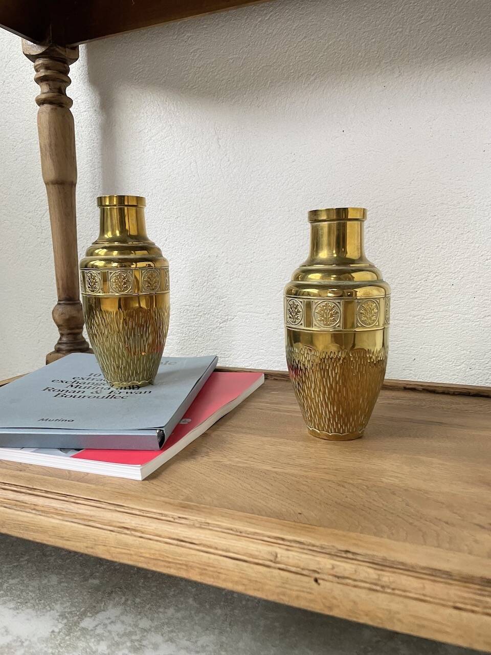 Duo of embossed brass vases