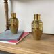 Duo of embossed brass vases