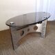 Table basse design vintage en alu brossé et plateau de verre.