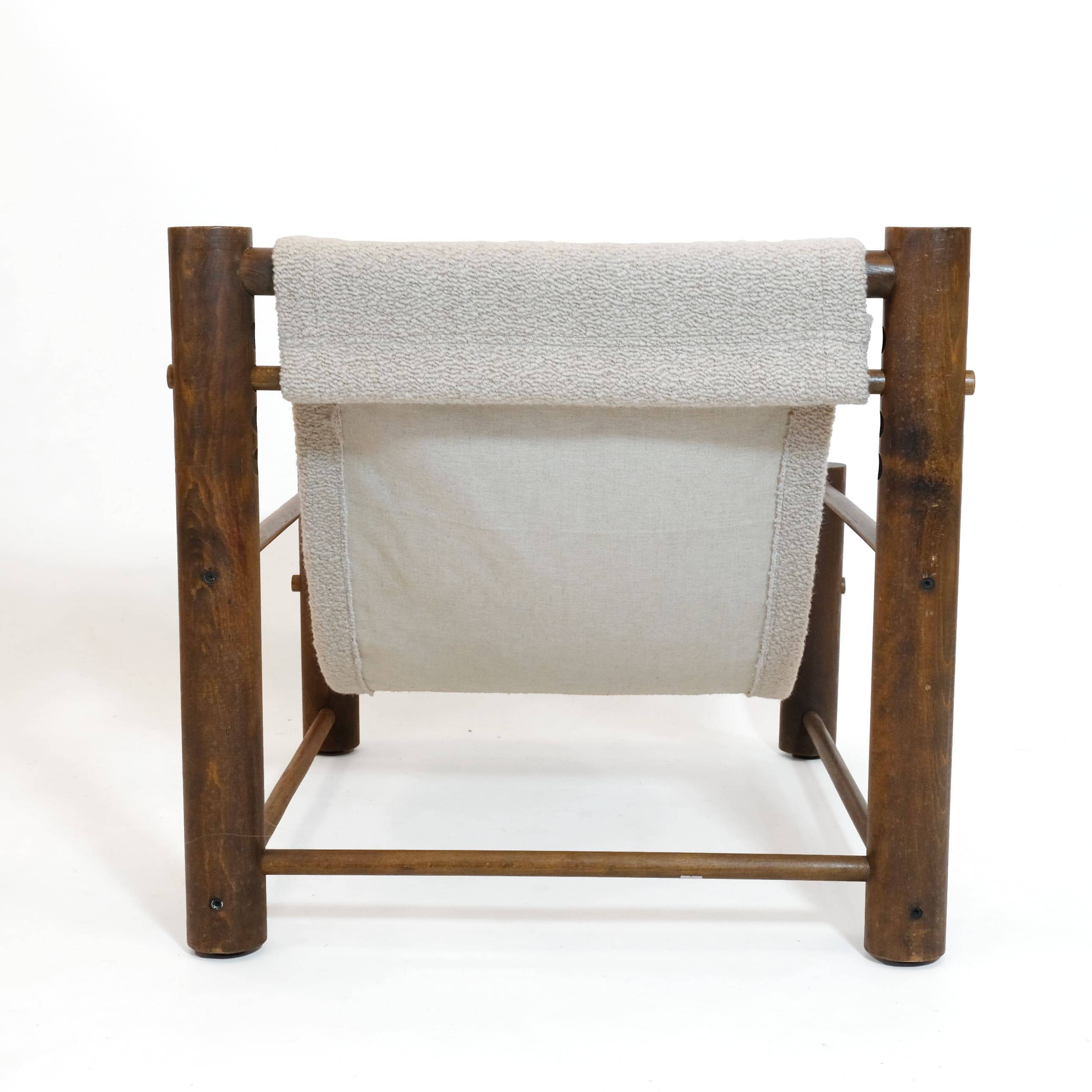 Solid wood armchair with adjustable backrest.