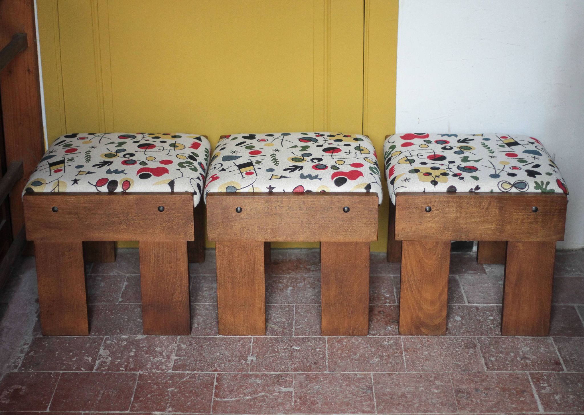 Set of 3 beech wood stools with fabric upholstery in the style of Miro.