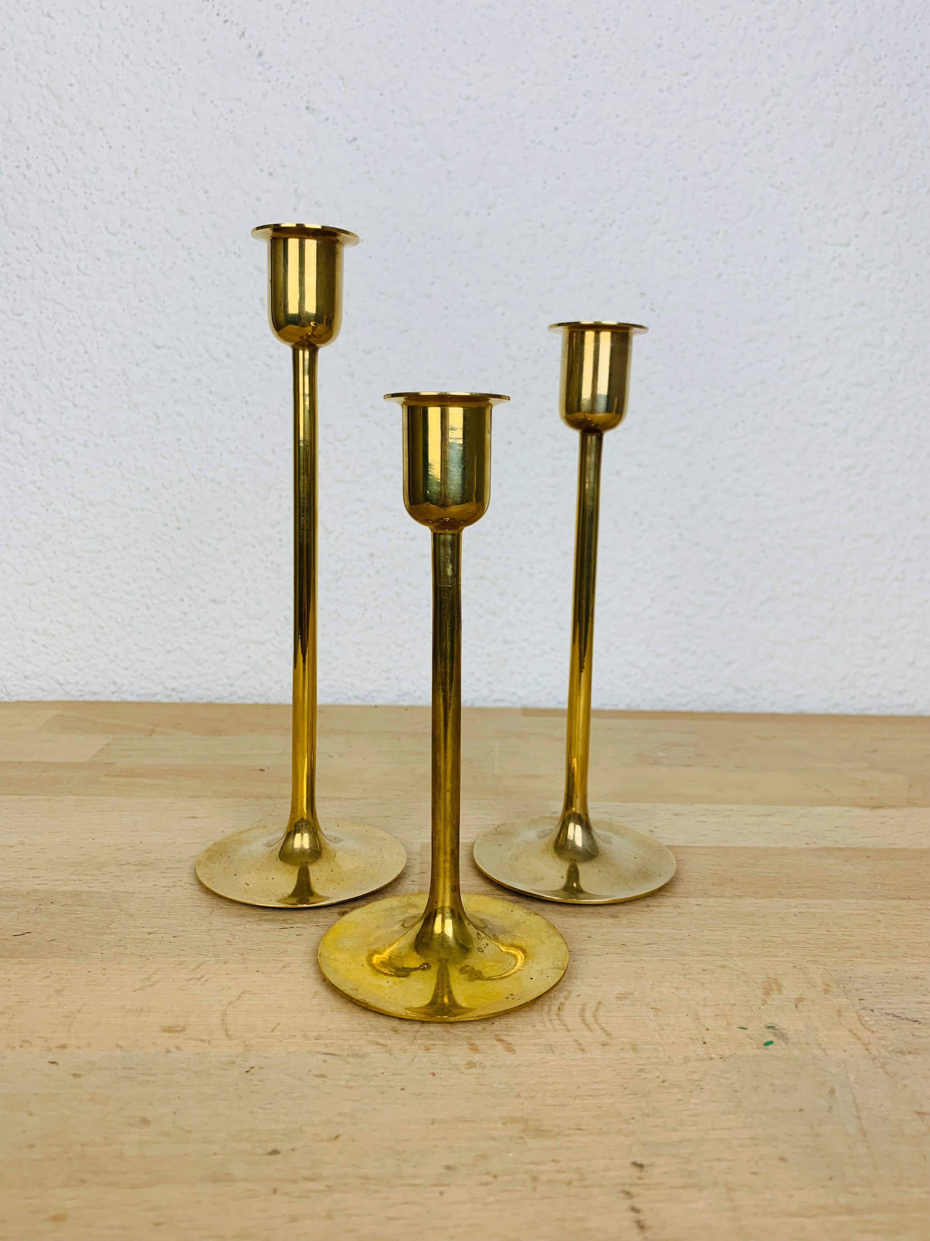 Three Scandinavian brass candle holders