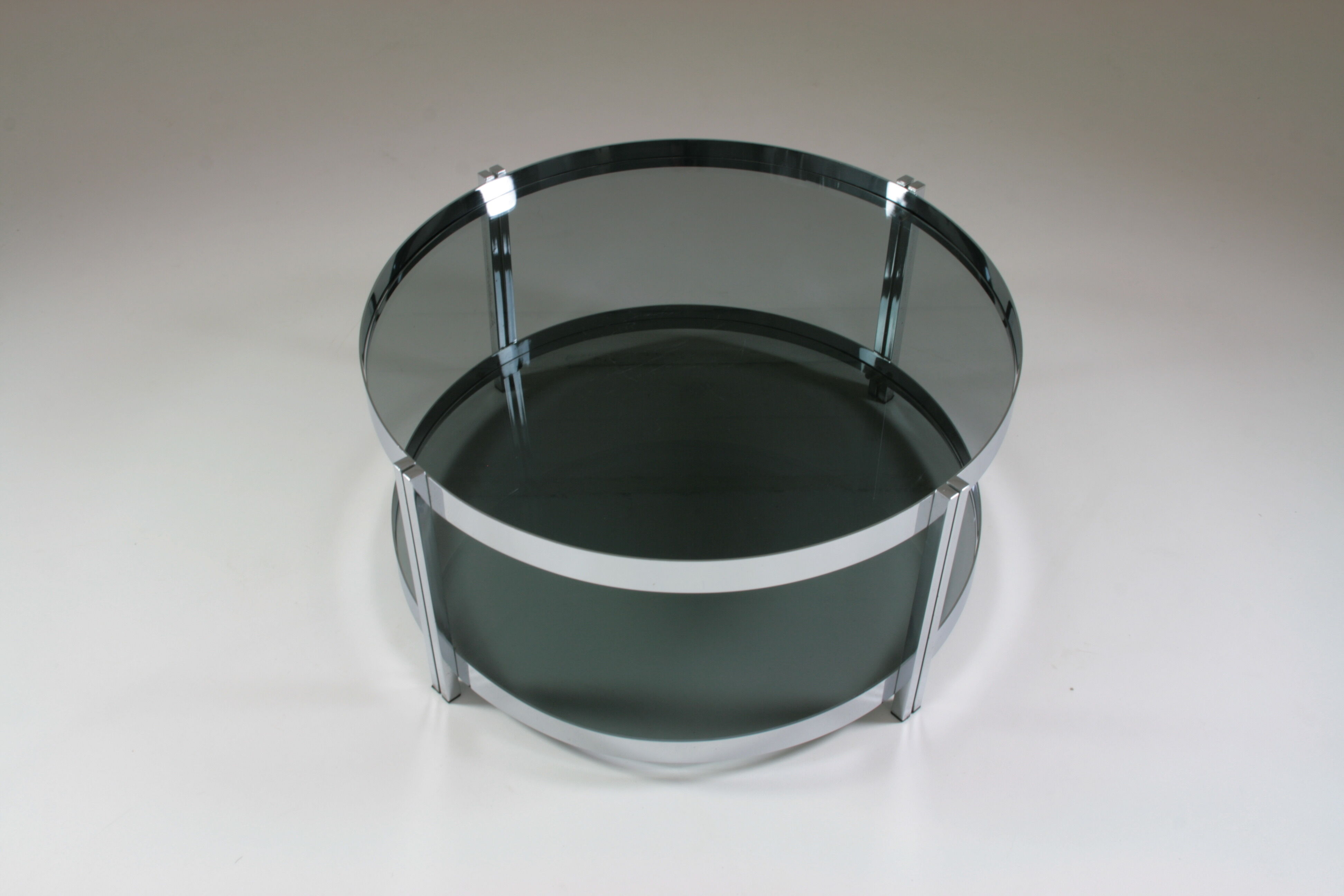Round chrome-plated metal coffee table and smoked glass tops, France 1970s