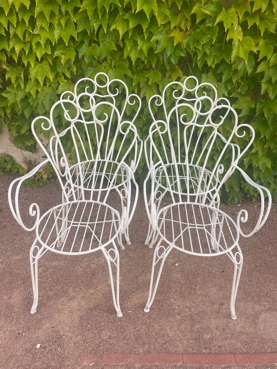 Provençal wrought iron armchairs