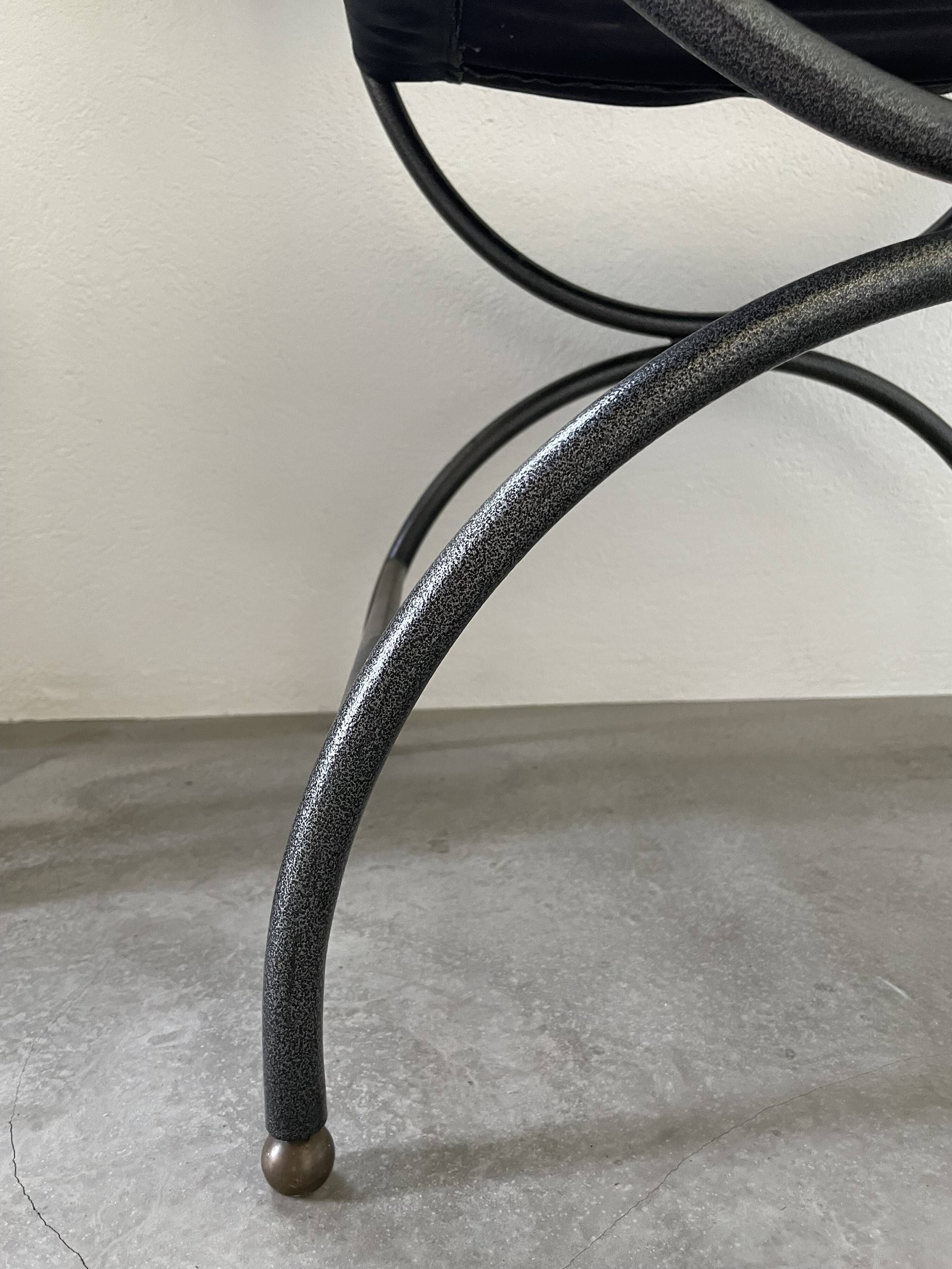 Pair of leather “curule” emperor armchairs