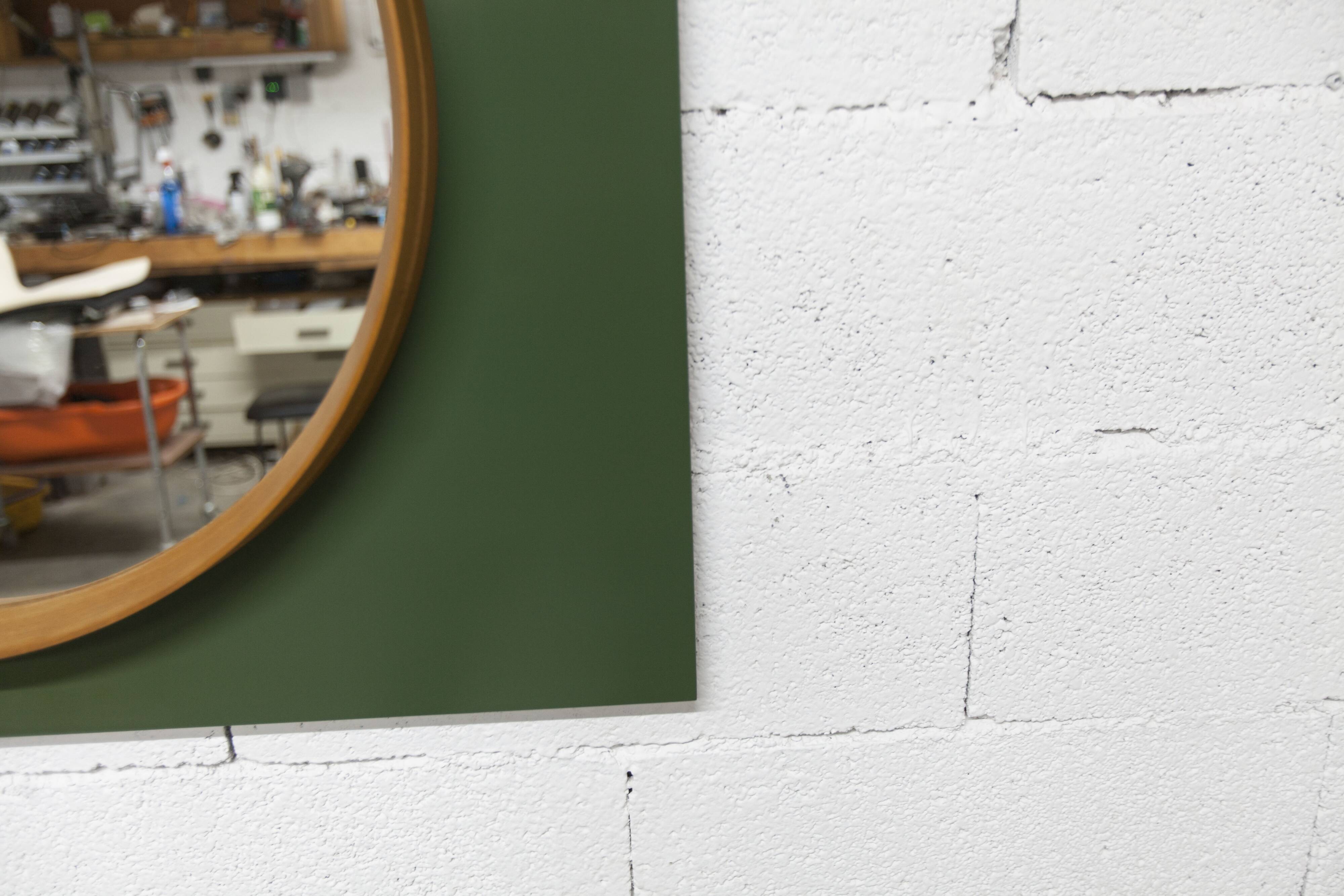 Unusual round wall mirror 60 cm teak edge on green rectangular board 1960.